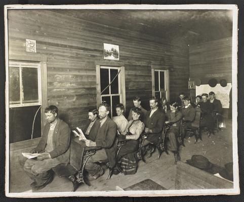 Kentucky students. Back of the photograph reads: Wording: Moonlight school, Christy, Rowan County, Miss Anna Carter, teacher, 32 enrolled