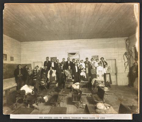 Kentucky students. Back of the photograph reads: The mothers came to school bringing their babes in arms