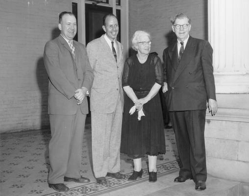 Groups; Unidentified; An older couple and two men on a large front porch