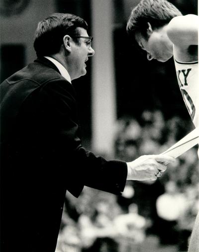 Hall, Joe B.; Joe B. Hall coaching a player from the sideline