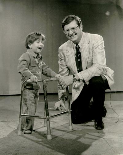 Hall, Joe B.; Joe B. Hall visiting a child in physical therapy