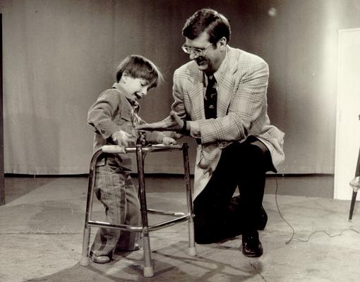 Hall, Joe B.; Joe B. Hall visiting the family of the boy in #1084