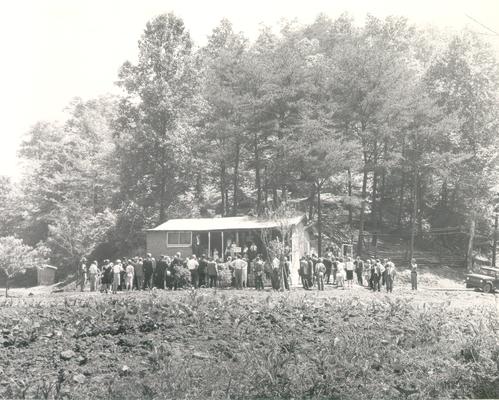 Johnson, Lyndon B. and Ladybird; A group of people await the arrival of the First Lady