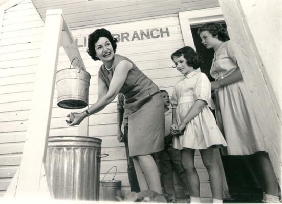 Johnson, Lyndon B. and Ladybird; Ladybird washing her hands; 1964, Red River, KY