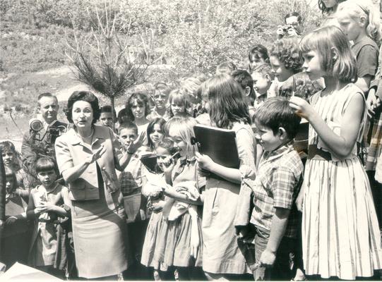 Johnson, Lyndon B. and Ladybird; Ladybird jokes with a crowd of children