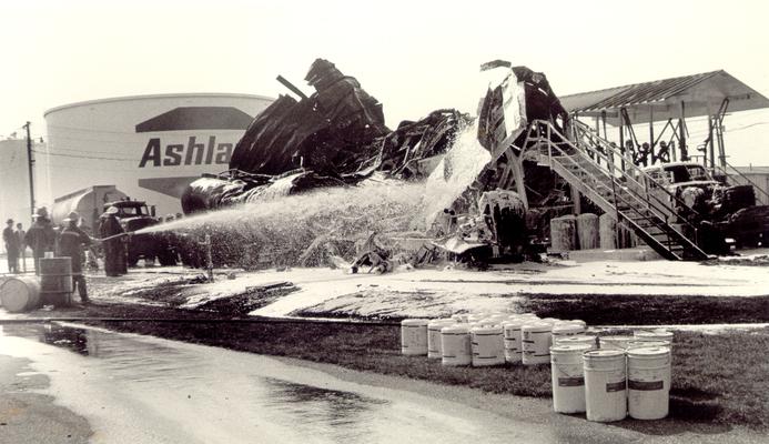 Ashland Bulk Oil Plant; 1973 Explosion and Fire; Firemen continue to spray down the wreckage