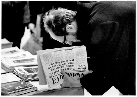 Men; Individual; Unidentified; A man holds a copy of Vietnam GI newsletter