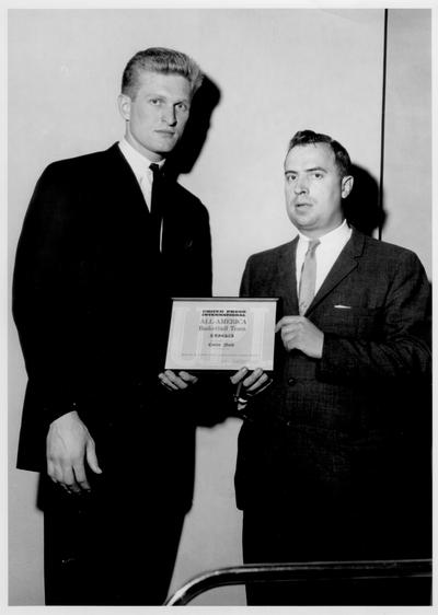 Nash, Cotton; Cotton Nash receives an award from the All-American Basketball Team, 1963