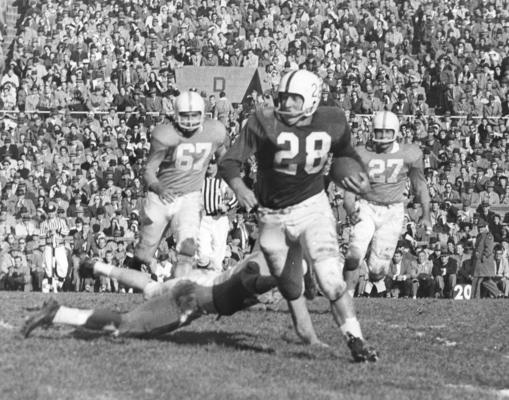 University of Kentucky; Football; Game Scenes; Halfback Bobby Cravens carries the ball in UK's 1958 victory over Tennessee