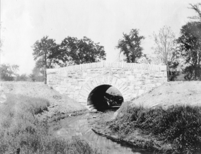 A stone bridge over a culvert. Silver Print