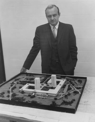 Coleman, Lawrence, Staff, Campus Planning, shown with a model of Kirwan - Blanding Student Housing Complex