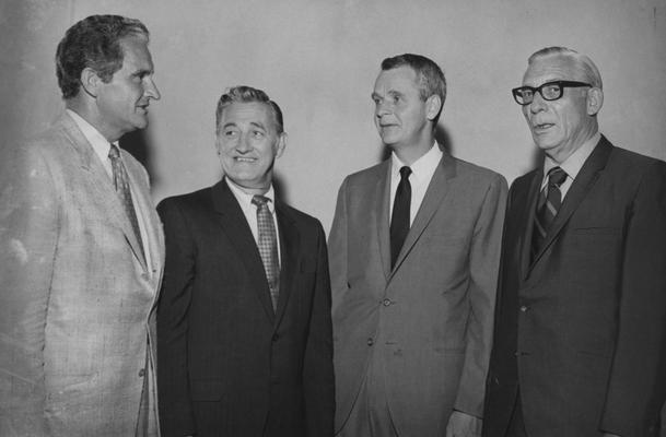 Creech, Glenwood L., Alumnus, B.S., 1941; M.S., 1950, Vice President of University of Kentucky Relations and Professor of Extension Education, Research Specialist in Vocational Education, 1965 - 1973, President of Florida Atlantic University, 1973 - 1983, pictured left with three unidentified individuals