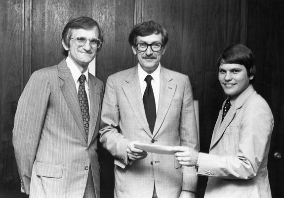 Eichhorn, Roger, Professor of Mechanical Engineering, Dean, College of Engineering, pictured (center) with two unidentified individuals