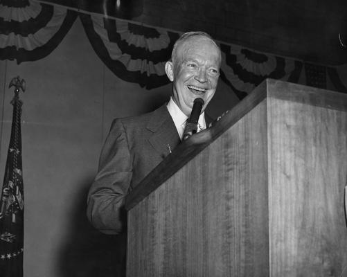 Eisenhower, Dwight D., 34th President of the United States, pictured speaking in Memorial Coliseum, October 3, 1956, at a stop during his campaign for a second term as President, Public Relations Department photograph, Photographer: Simmons Studio, featured in 1957 