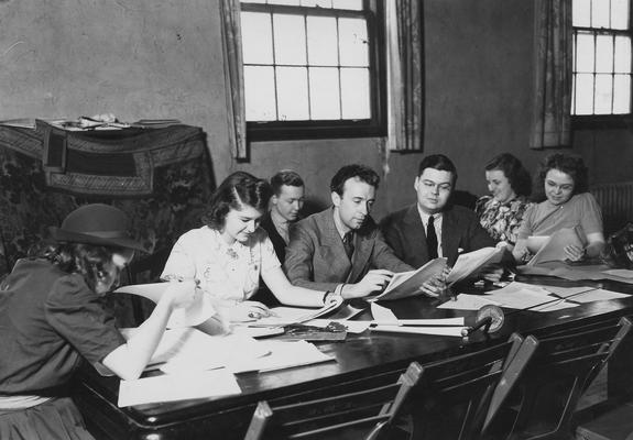 Fowler, Frank, Professor of Theater Arts, Director of Guignol Theater, pictured third from left with Genevieve Howard (far left), unidentified, Greer Johnson (against wall), Fowler, Sam Nuckolls, unidentified, Gail Kiry Sneider