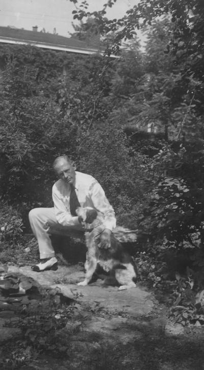 Funkhouser, William D., Professor of Zoology and Anthropology, Anthropology Department, Dean of Graduate School, pictured with pet dog