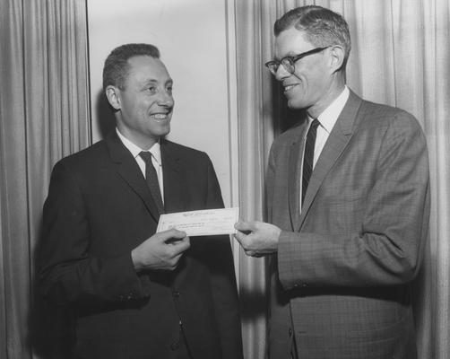 Githens, John H., Chair, Department of Pediatrics, pictured receiving a research donation from W. H. Rennie of Wyeth Laboratories, April 18, 1962, Photographer: Mack Hughes