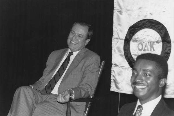 Jones, Adrian, right, with Charles Wethington, left, who accepts a chair from the University of Kentucky Omicron Delta Kappa, national leadership honor society for college students, faculty, staff, administrators, and alumni that recognizes and encourages superior scholarship, leadership, and exemplary character