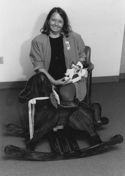 Ogden, Suellen, staff assistant in the department of Medicine makes wooden horses with her spouse, Warren who works in the UK cabinetry shop for children featured in the staff newspaper, Communi-K