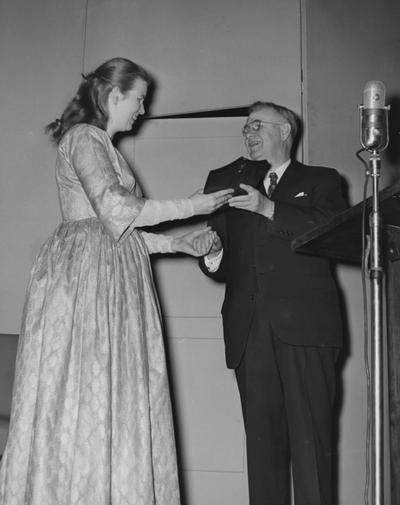 Ritchie, Jean, University of Kentucky Graduate, Folk Singer, President H. L. Donovan is presenting Ritchie with the school's first Founder's Day Award