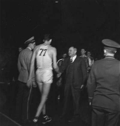 Rupp, Adolph, University of Kentucky Basketball Coach 1930-1971, pictured shaking hands with Bill Spivey