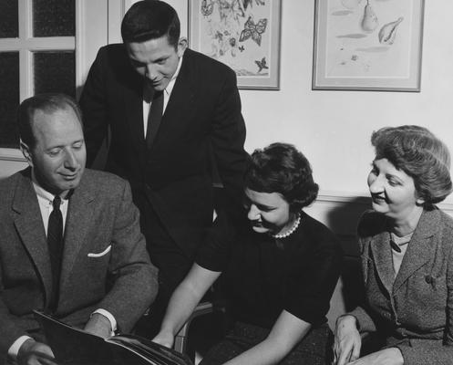 Seward, Doris, Dean of Women and Professor of Education, pictured with Dean of Men, Dean L. L. Martin, and students, from Public Relations Department