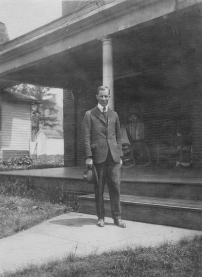 Smith, Guy, Instructor of Mathematics 1918-1920, pictured in his room during Christmas time