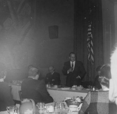 Thompson, Lawrence S., Director of Libraries 1948-1965, Professor in Classics 1965-1979, pictured speaking at a book fair dinner in Bluefield WA