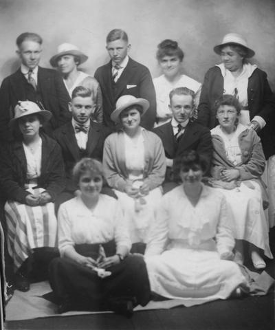 Tuttle, Margaret, Class of Morton High School in Lexington, KY, Now in 2005, it is a Junior High or sometimes referred to as a Middle School, these are the graduating seniors at a picnic at Bluegrass Park in 1891, Margaret Tuttle is on the second row, the first woman on the left and wearing a hat, her face is shaded by the hat, Margaret was a librarian 1926-1964 at the University of Kentucky Library, she graduated from the University of Kentucky in 1915 with a A.B., B.S., and L.S. Degrees, she was a student assistant 1926-27