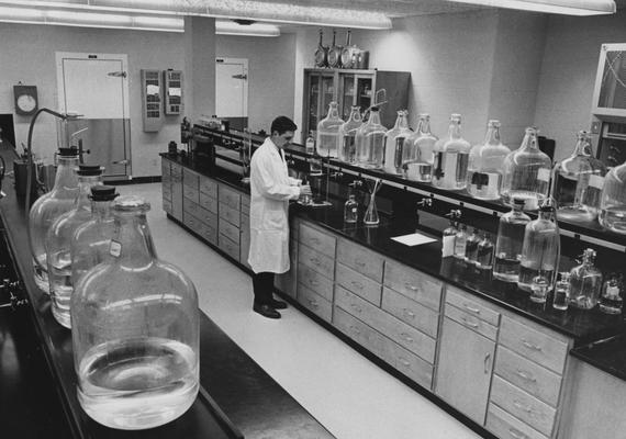 Watkins, Jesse Scott, graduate student is pictured conducting an experiment in the College of Engineering sanitary engineering laboratory, which is in the College's new Anderson Hall, much of the University of Kentucky's Water Resources Institute Research is done in this lab