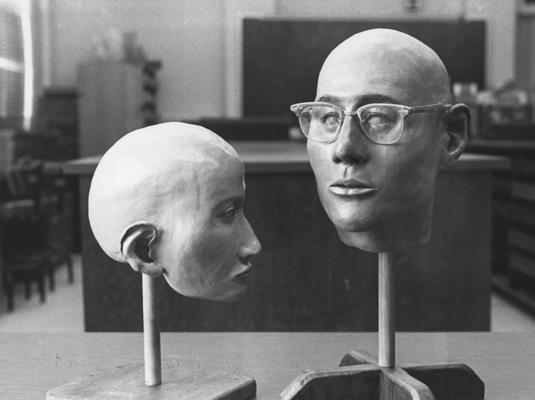 Wolf, David, pictured with Virginia Smith, an anthropolgy student, with the reconstructed face of an unidentified man found in Breathitt County 1979, from University Information Services