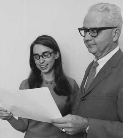 Wonderley, A. Wayne, Professor of Germanic language and literature pictured presenting Miss Rita Wright with appointment for the 17th University of Kentucky Heidelberg Exchange Scholar for the 1970-1971 Academic Year