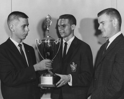 Young, Jim, President of Farmhouse Fraternity won trophy for scholarships, pictured with Bill Cooper (left) and Tom Scott (right)