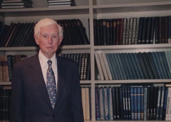 Young, William T. Sr., he was a member of the Board of Trustees, Pictured at the dedication of the William T. Young Library, Young is a philanthropist, businessman, and owner of Overbrook Horse Farm, Instrumental in book endowment and building of William T. Young Library, pictured standing in front of bookcase