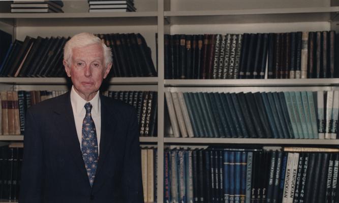 Young, William T. Sr., he was a member of the Board of Trustees, Pictured at the dedication of the William T. Young Library, Young is a philanthropist, businessman, and owner of Overbrook Horse Farm, Instrumental in book endowment and building of William T. Young Library, pictured standing in front of bookcase