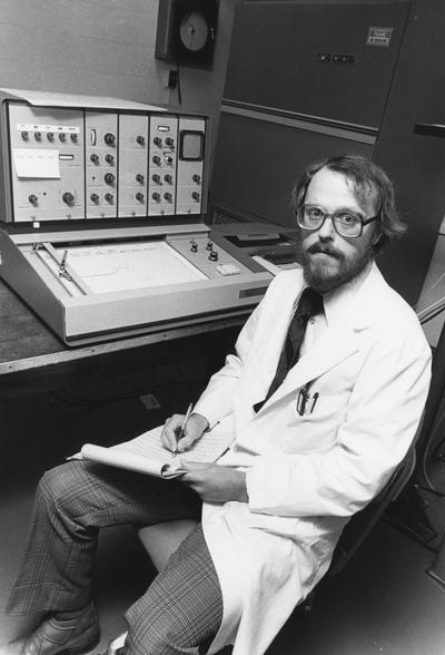 Butterfield, David Allen, Professor of Chemistry working in laboratory for football program, photographer:Photographic Services Image # 20402