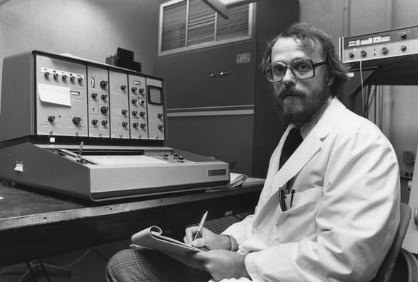 Butterfield, David Allen, Professor of Chemistry working in laboratory for football program, photographer:Photographic Services Image # 20402