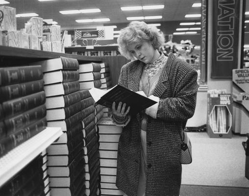 Unidentified, student in the University of Kentucky Bookstore, Photographer: Clay Owen, Photographic Services Negative File-Regular Series 27583