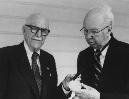 Cogar, James L., Alumnus, A. B. 1927, shown here receiving the Shakertown Medal from Earl D. Wallace, Alumnus, B. S. 1921