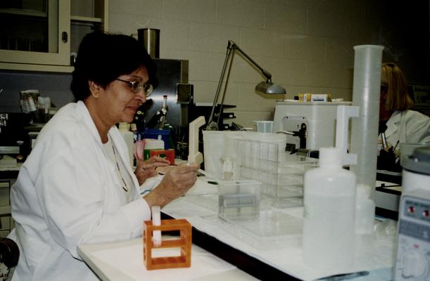 Female working in a College of Health Sciences laboratory