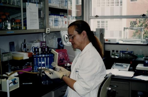 Female working in a College of Health Sciences laboratory