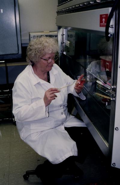 Female working in a College of Health Sciences laboratory