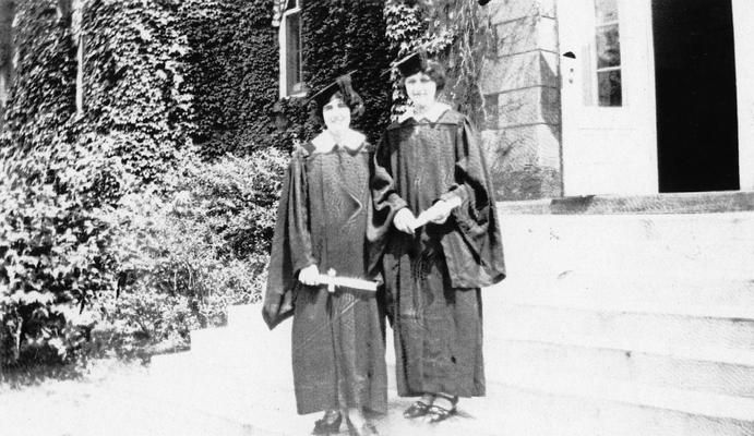 Carrol, Elizabeth (Betty), Alumna, pictured (left) with unidentified friend at graduation