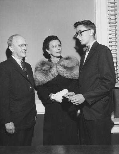 Chamberlain, Leo M., Professor, Education, University Vice President, Receiving a donation on behalf of the University from Mrs. Jack Webb, Sr. and Jack Webb, Jr., to start a loan fund for students and the College of Medicine, Public Relations Department