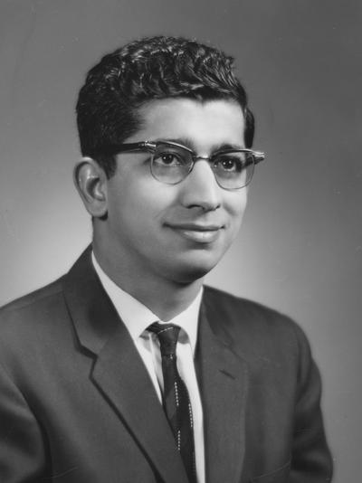 Chapra, M. Ulmer, Professor of Economics