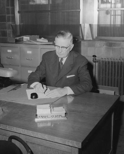 Clifton, Louis, Director, Department of University Extension, Public Relations Department, featured in 1957 