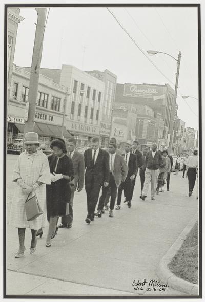 Demonstrators marching along Lexington's Main Street