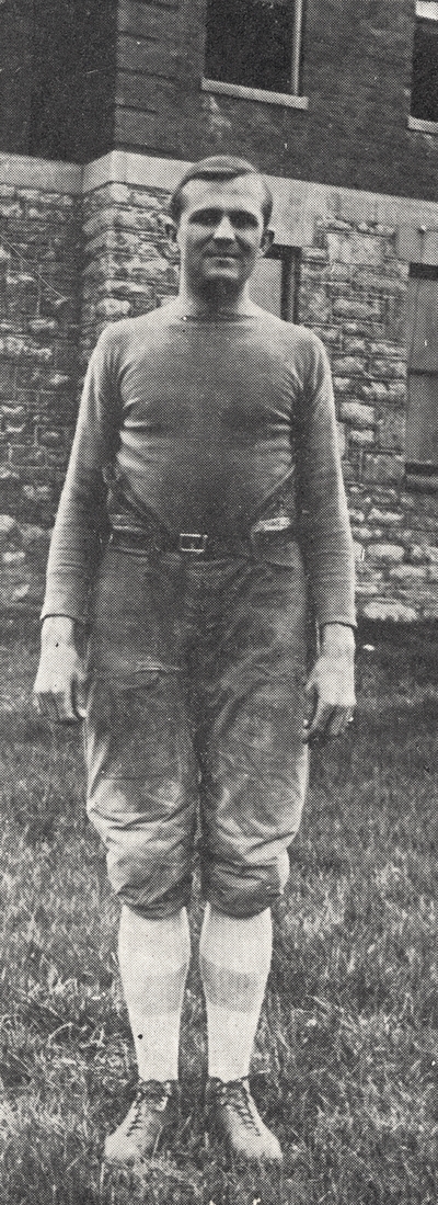 A card with a portrait of J. W. Thompson in his football uniform. The front of the card has printing which reads, 