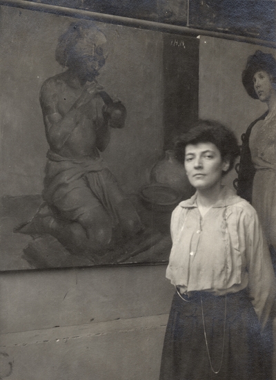 A portrait of an unidentified woman standing beside a painting of a man playing a musical instrument. This image was found pasted to the front of page 101 of the 