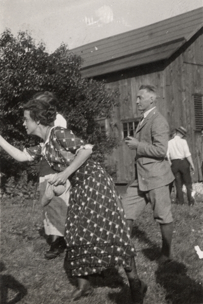 An image two men and two women outside near a barn. Margaret Ingels is in the action of throwing something. Christopher Schrader 